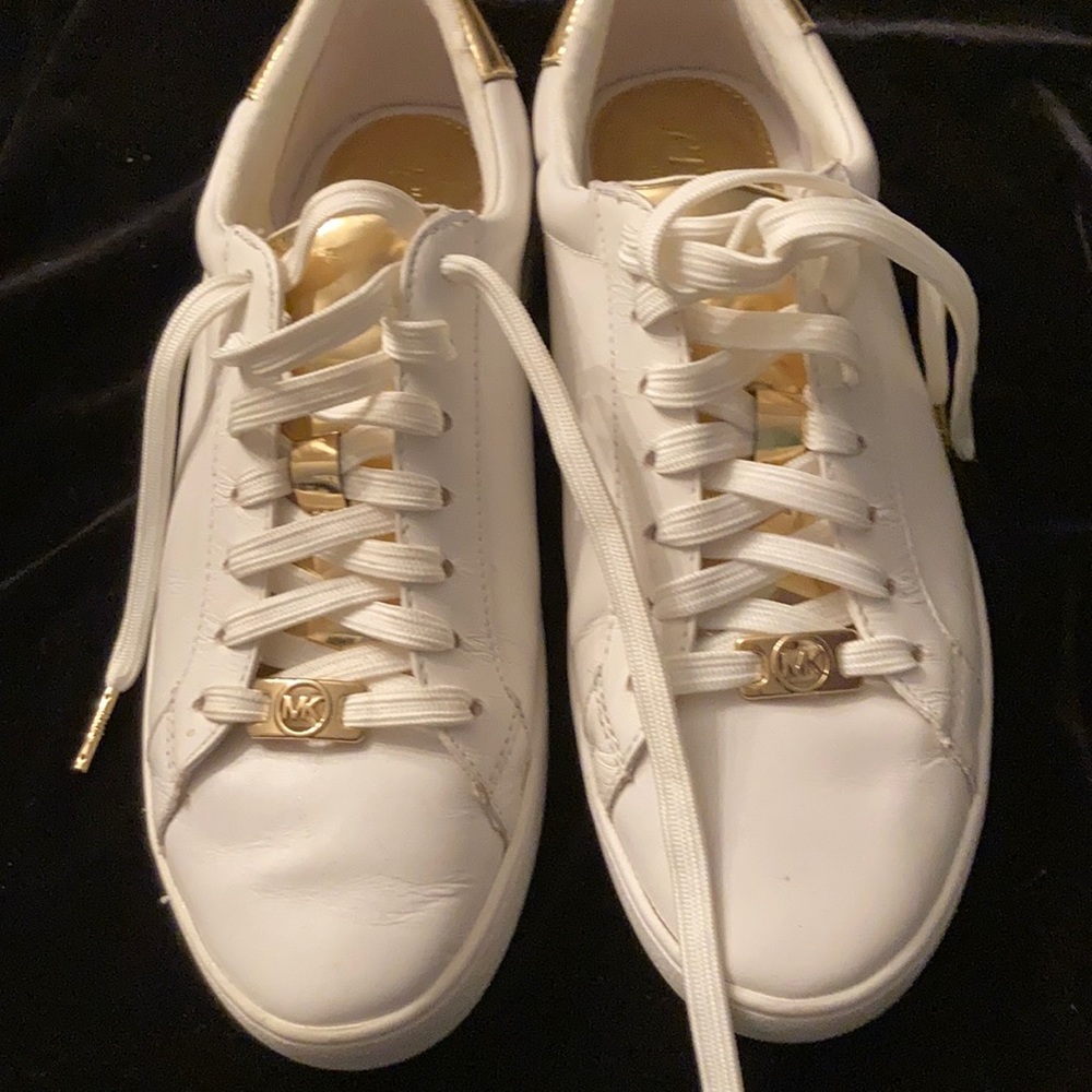 Leather white Michael Kors sneakers with gold embellishments